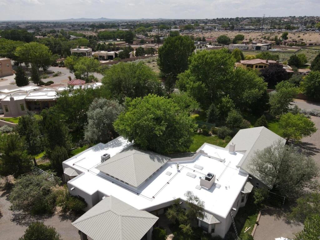 Aerial view of a completed roof in a New Mexico neighborhood