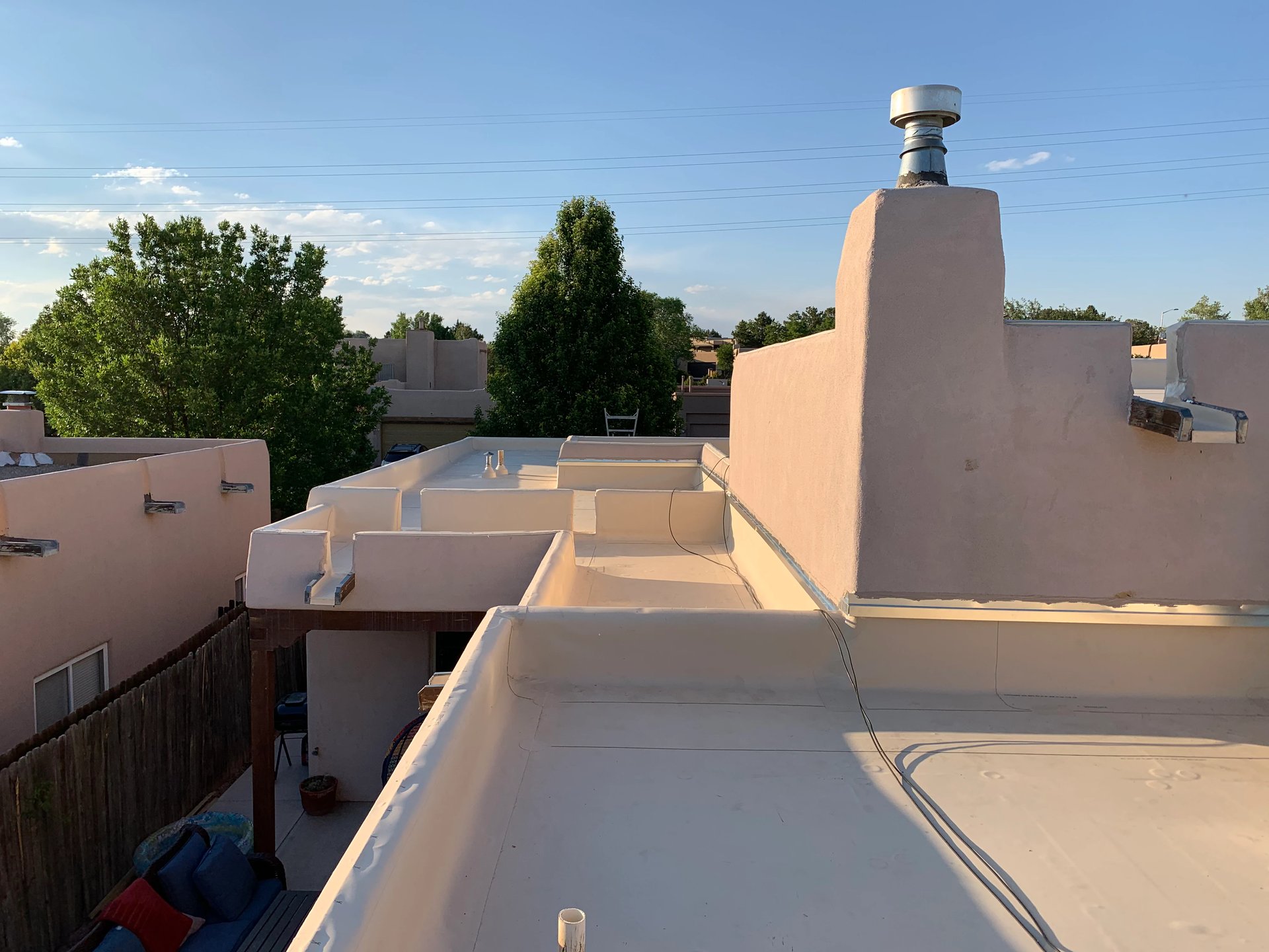 Flat foam roof system with a mountain backdrop