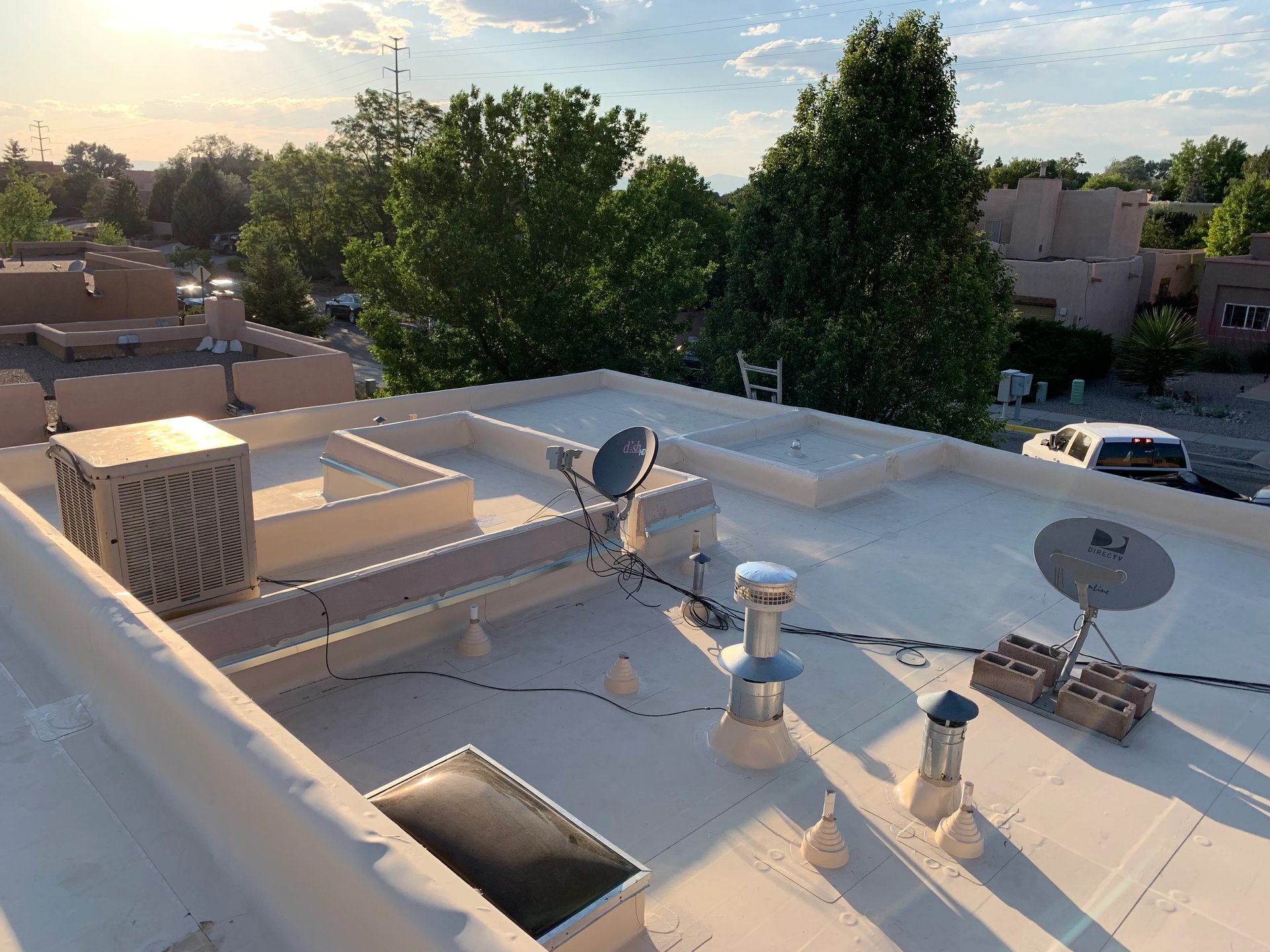 Flat TPO roof with rooftop HVAC units